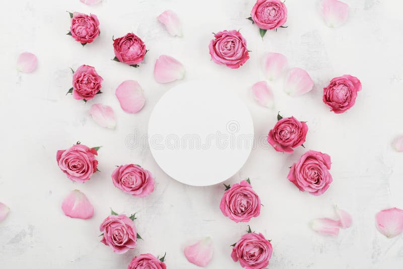 White round blank, pink rose flowers and petals for spa or wedding mockup on light background top view. Beautiful floral pattern. stock photo White round blank, pink rose flowers and petals for spa or wedding mockup on light background top view. Beautiful floral pattern. stock photo