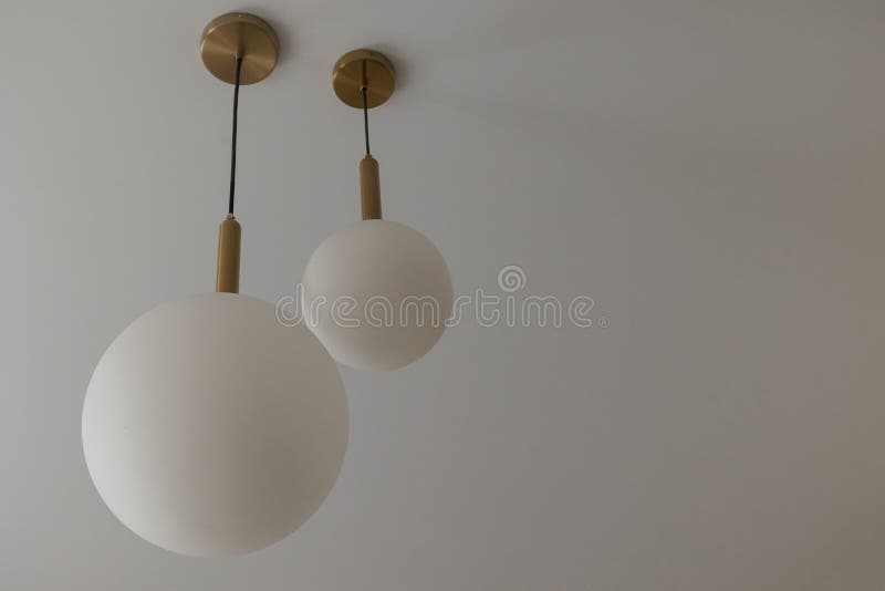 A White Round Light Bulb in a Modern Interior of a House Room Stock