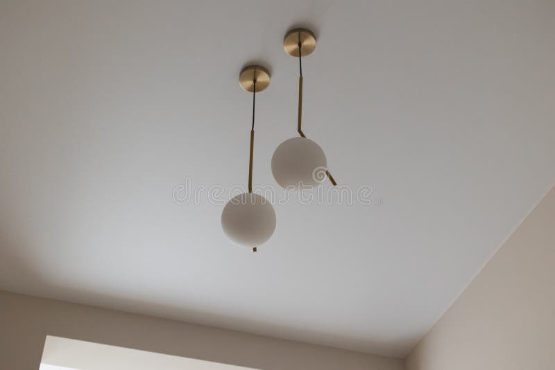 A White Round Light Bulb in a Modern Interior of a House Room Stock