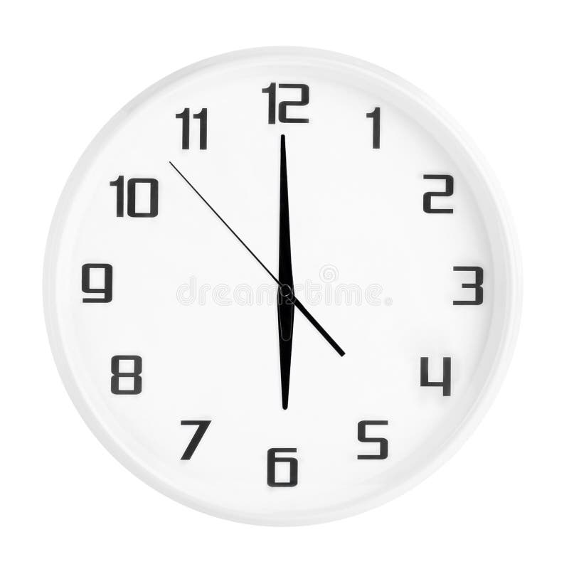 White round office clock showing six o`clock isolated on white background.