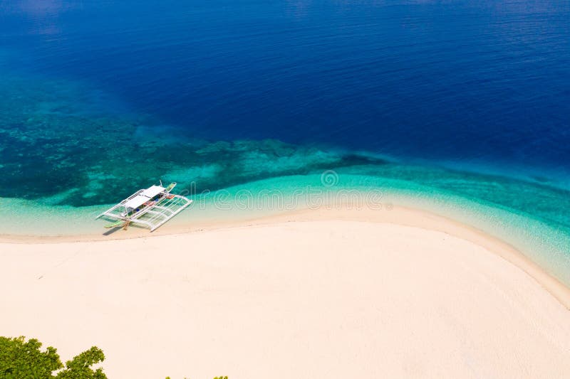 White sand beach and blue sea, view from above . Mahaba Island, Philippines. advertising concept