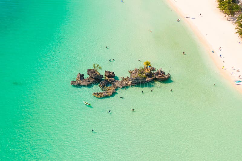 White sand beach and lagoon with turquoise water, aerial view. Boracay island Grotto, Willy`s Rock.