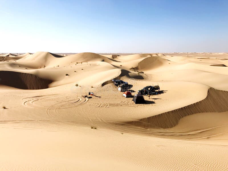 People camping in the White sand dunes in the desert in the Middle East