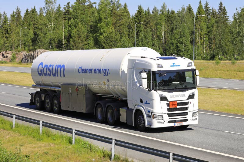 TURKU, FINLAND - MARCH 22, 2014: White Scania V8 truck and full trailer  parked. Scania truck with an Euro 6 engine wins Green Truck award for the  seco Stock Photo - Alamy