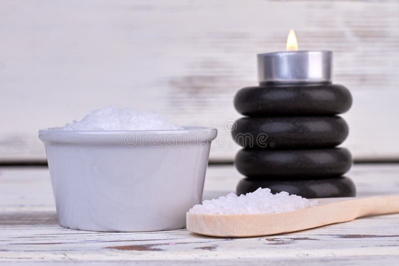 White Sea Salt with Stack of Stones and Burning Candle. Stock Photo