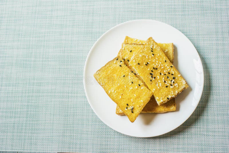 White Sesame and Black Sesame Biscuits in a White Plate Stock Photo