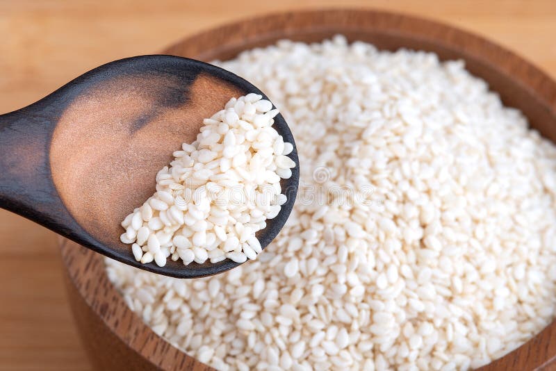White Sesame.White Sesame Seed on Wooden Bowl for Healthy Eating Stock