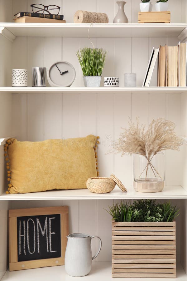 White Shelving Unit with Plants and Decorative Stuff Stock Image