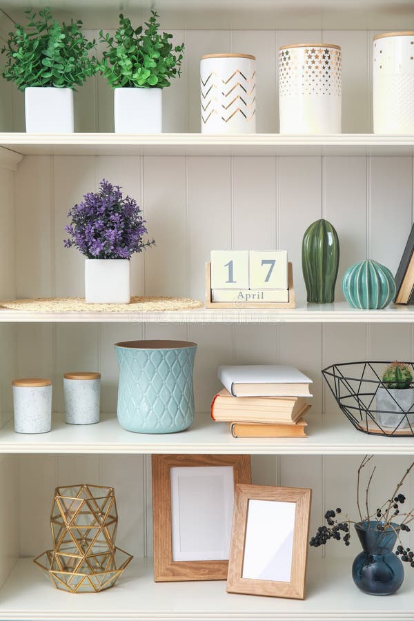 White shelving unit with plants and decorative stuff royalty free stock images White shelving unit with plants and decorative stuff royalty free stock images