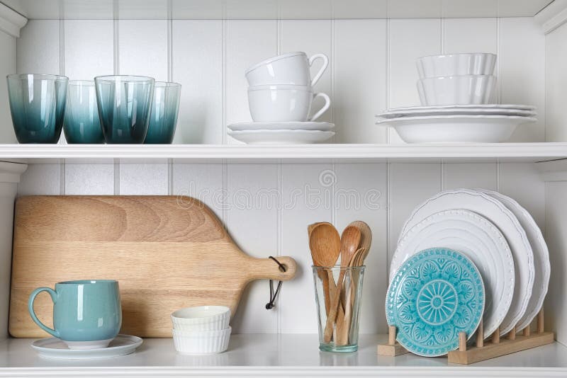 White shelving unit with set of dishware royalty free stock photo White shelving unit with set of dishware royalty free stock photo