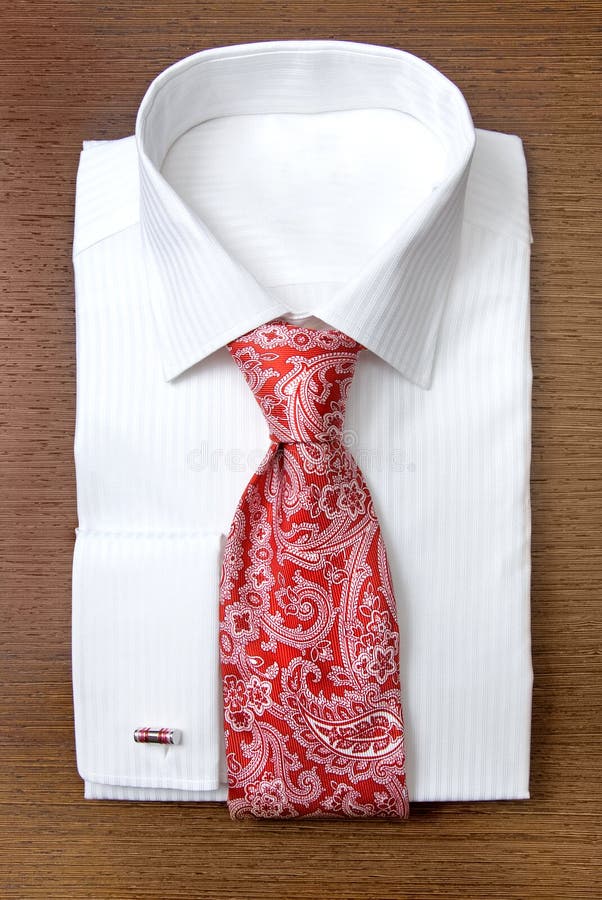 White shirt with red tie on the shelf