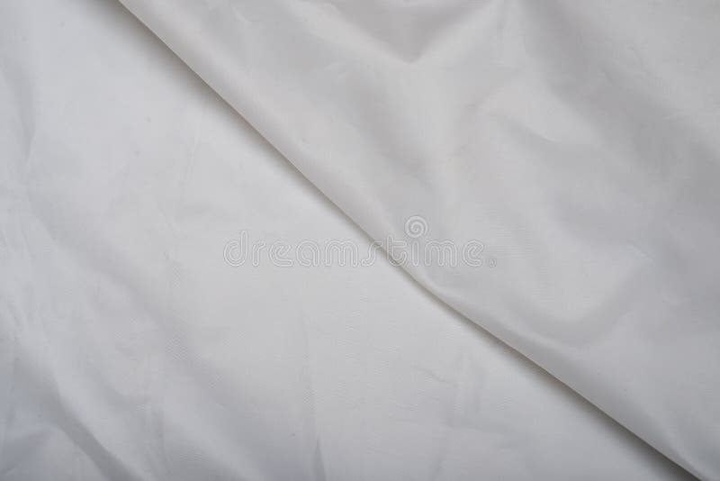 White silky fabric making background with a line in center royalty free stock photos