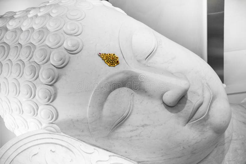 White sleeping peace Buddha face.