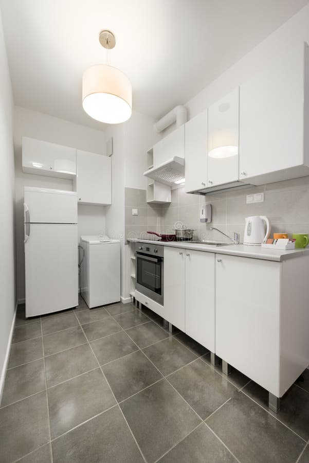 White Small And Compact Kitchen Interior Design Stock Photo