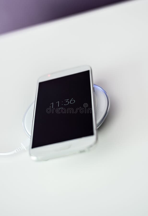 White Smartphone Charged by Wireless Charger Stock Image Image of