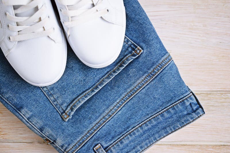 Blue Jeans And White Sneakers Stock Image Image of trousers, brown