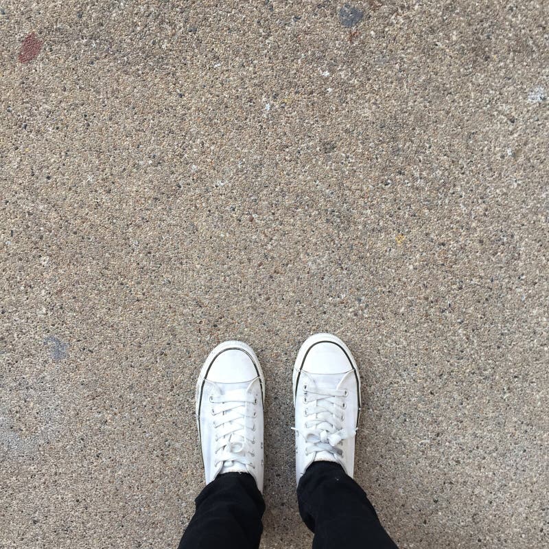 White Sneakers Shoes Walking on Ground Top View Stock Image - Image of ...