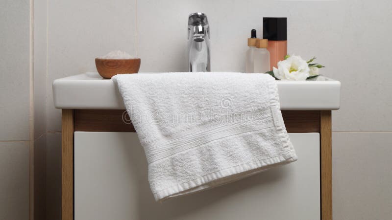 White Soft Towel on Sink in Bathroom Stock Photo - Image of hygiene, cloth: 260511718