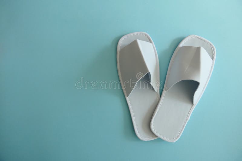 White Spa Slippers Isolated on Light Blue Background Stock Photo