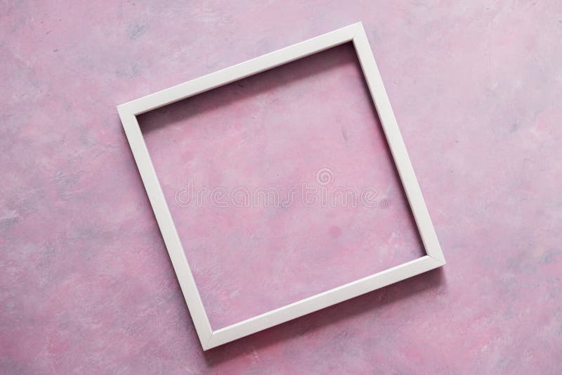 White square picture frame mock-up with copy space for yout text or image on top of pink background stock photography White square picture frame mock-up with copy space for yout text or image on top of pink background stock photography
