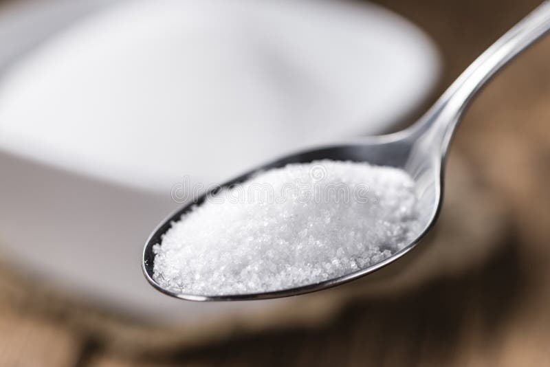 White Sugar on a spoon stock photo. Image of closeup 75143924
