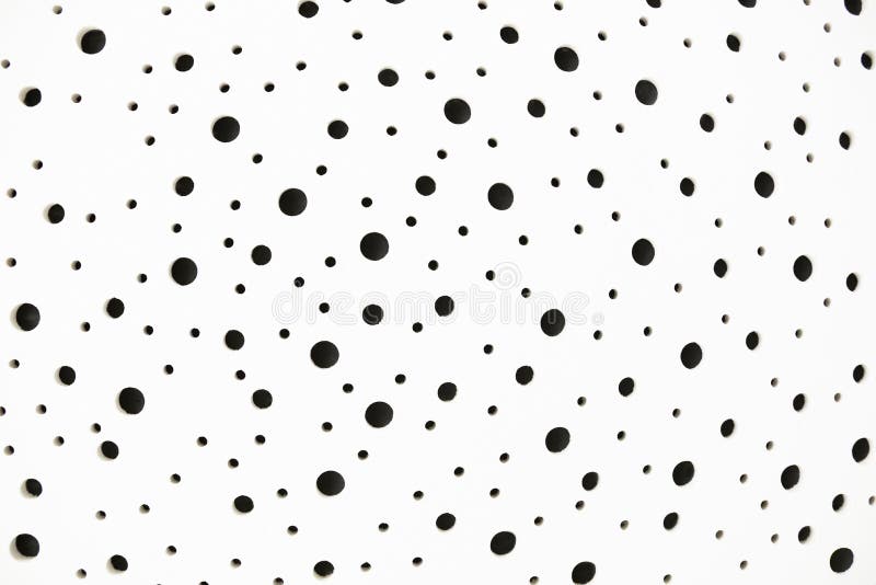 White Surface with Black Holes Stock Photo - Image of polka, fabric ...