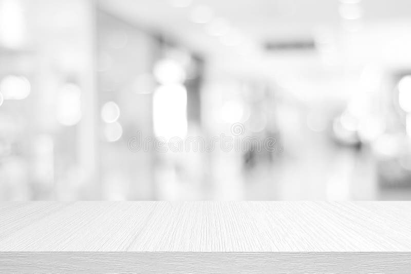 White table presentation, desk and blur background, Empty wood counter, shelf surface over blur restaurant white bokeh background stock photography