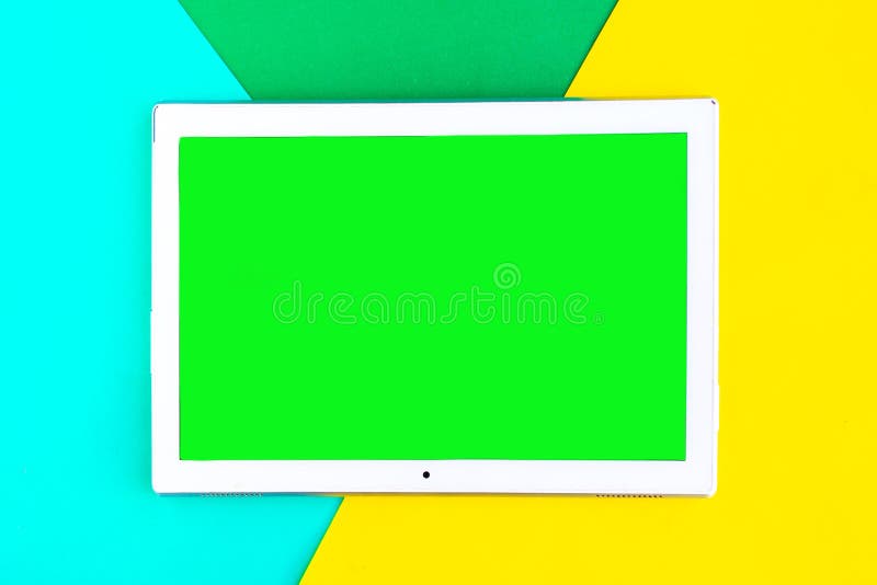 Tablet Device with Green Screen on Color Geometric Background Stock