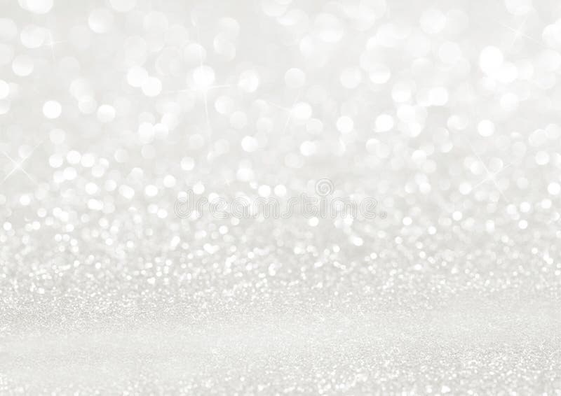 White texture background with glitter sparkles. Festive glitter background.