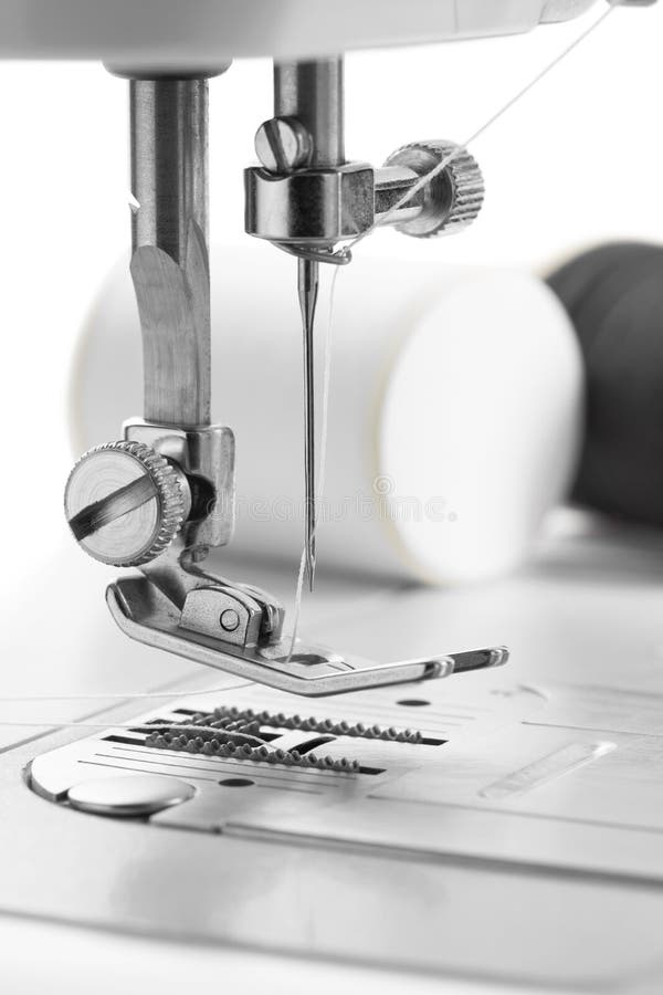 White Thread through the Needle Eye.the Side of the Sewing Machine