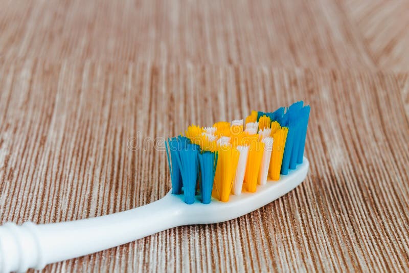 White Toothbrush without Toothpaste on a Light Background. Stock Photo