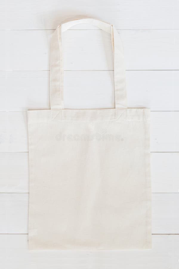 Blank Eco Friendly Beige Colour Fashion Canvas Tote Bag for branding,  Isolated on White Background. Clear reusable Bag for Groceries mock up.  Empty linen fabric tote bag for template. Front View. Stock