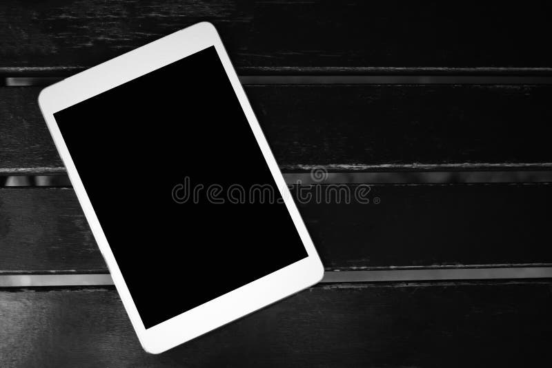 White Touchscreen tablet with black blank copy space screen for advertising or social media text on black wood table, Technology concept, Business concept,Vignette and Dark tone, phone, computer, background, pad, pc, empty, communication, display, device, wooden, top, office, internet, electronic, mobile, wireless, touchpad, lifestyle, equipment, digital, desk, monitor, portable, multimedia, message, smartphone, comfort, player, view