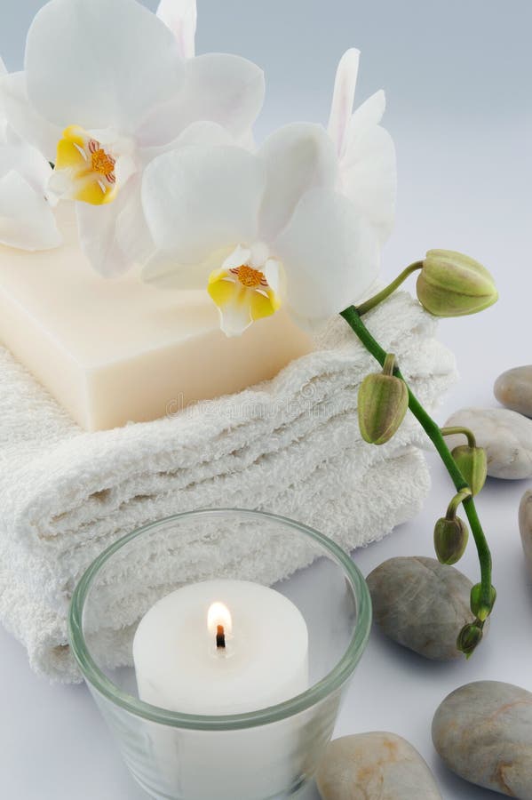 White towels and orchid, candle