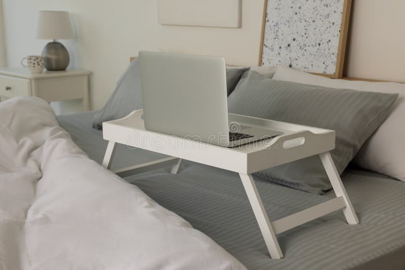 White Tray Table with Laptop on Bed Stock Image Image of bedroom