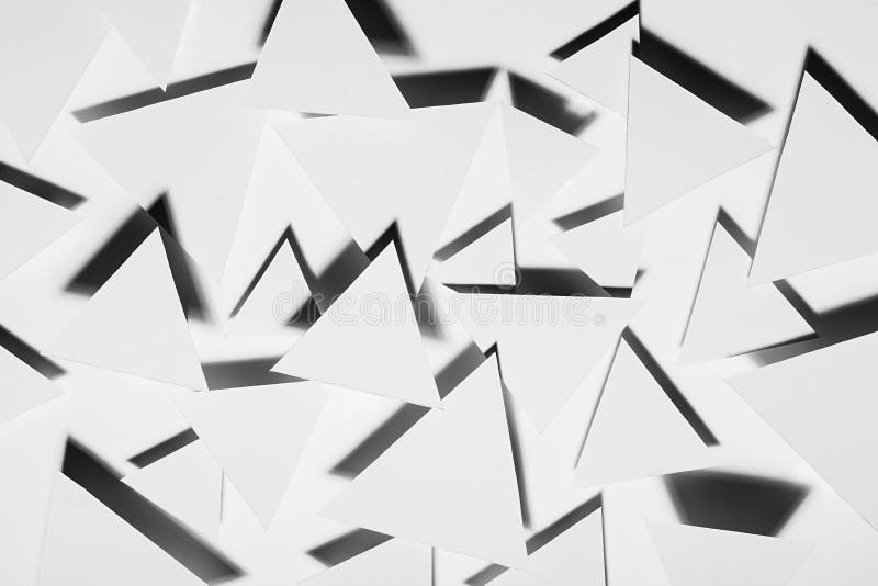 White triangles geometric pattern in hard light with strict black shadows in random with sharp angles, top view. Energy. royalty free stock images