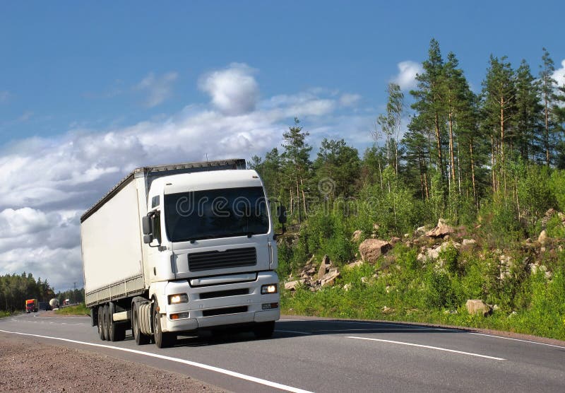 White truck on country highway stock photography White truck on country highway stock photography