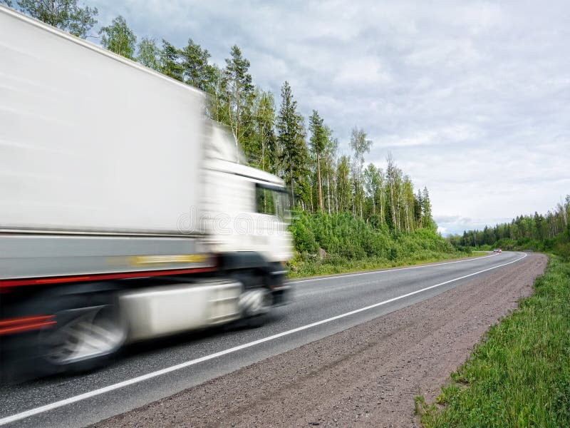White truck speeding on rural highway, motion blur royalty free stock image White truck speeding on rural highway, motion blur royalty free stock image