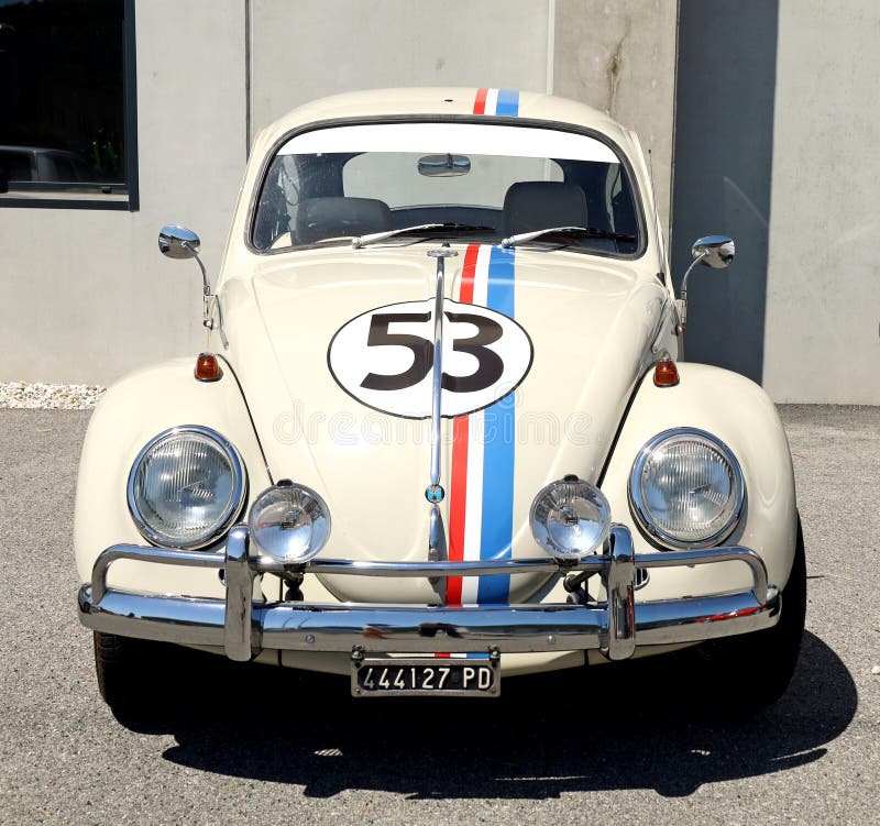 White Volkswagen Type 1 , known as beetle . Front view.