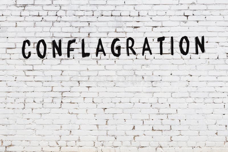 White Wall with Black Paint Inscription Conflagration on it Stock Photo