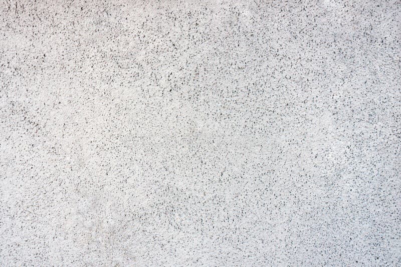 White wall in speckles background, texture