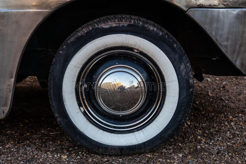 The White Wall Tire of a Classic Car that is Slightly Weathered Stock