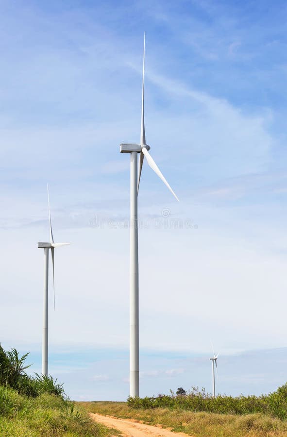 White wind turbines generating electricity in wind power station alternative renewable energy from nature royalty free stock photography White wind turbines generating electricity in wind power station alternative renewable energy from nature royalty free stock photography