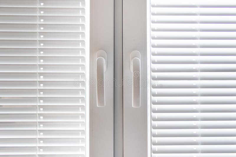 White windows with blinds royalty free stock image White windows with blinds royalty free stock image