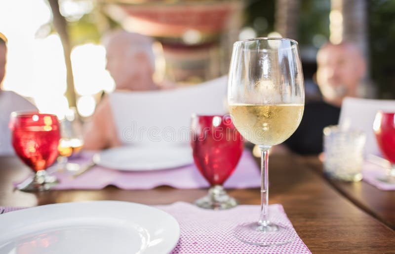 White Wine in a Glass on a Table at a Restaurant in Me Stock Photo