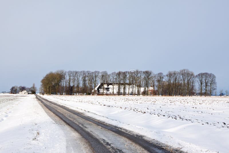 White winter landscape of field with farm stock images