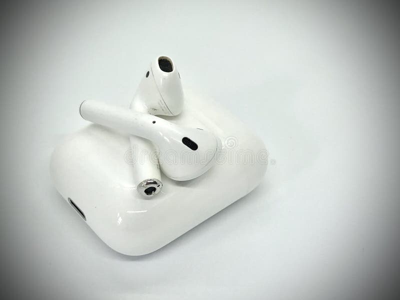 White Wireless Earbuds Out of Charging Case