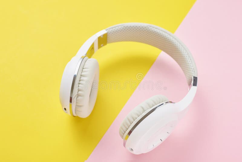 White Wireless Headphones And Smartphone On A Blue And Yellow