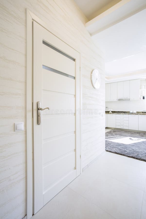 White, wooden door in modern house