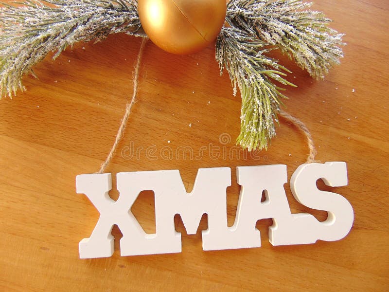 White Xmas Letters with Christmas Decoration on Wood Stock Image